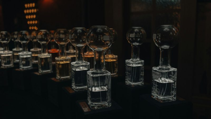 A row of glass trophies on display