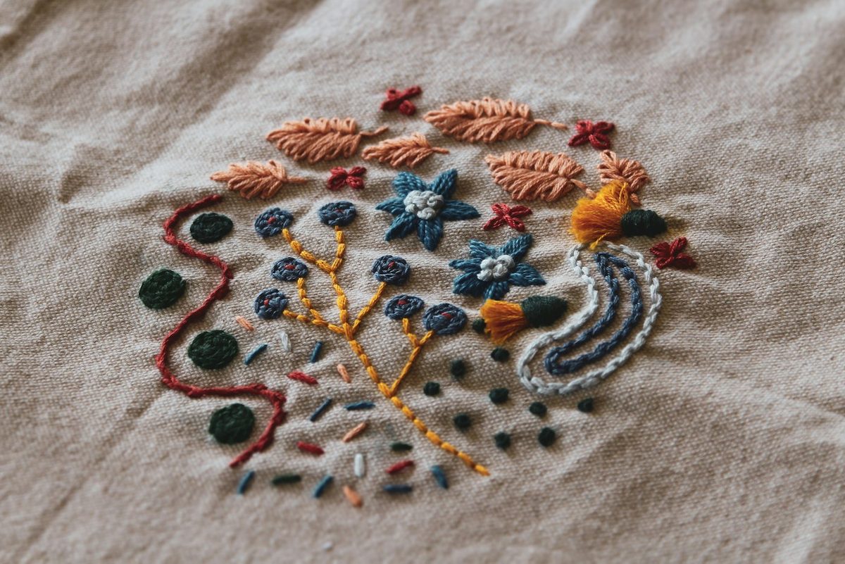 A colourful embroidered design on fabric